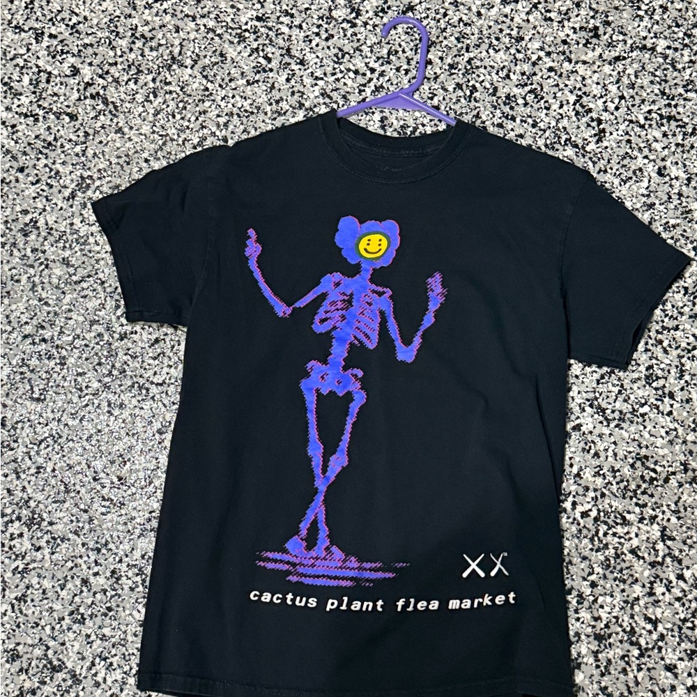 Kaws Cactus Plant Flea Market Black Graphic Tee - Purple Skeleton Smile